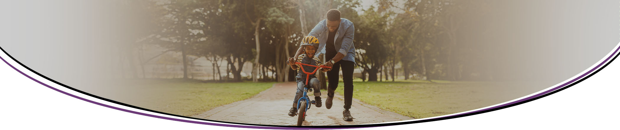 Child riding back with father